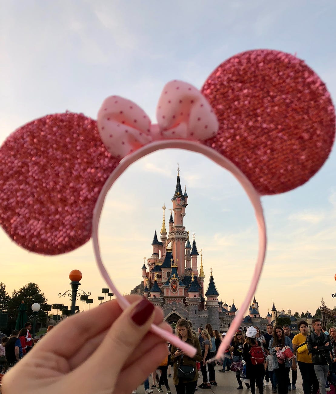 person holding pink headband