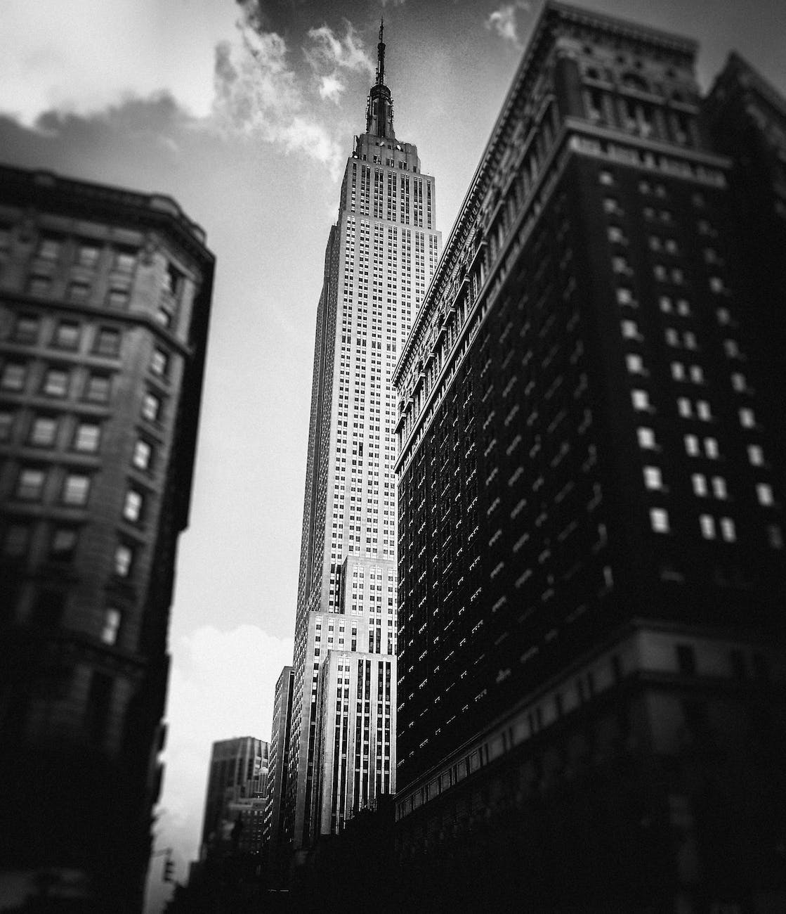 grayscale low angle photo of high rise buildings