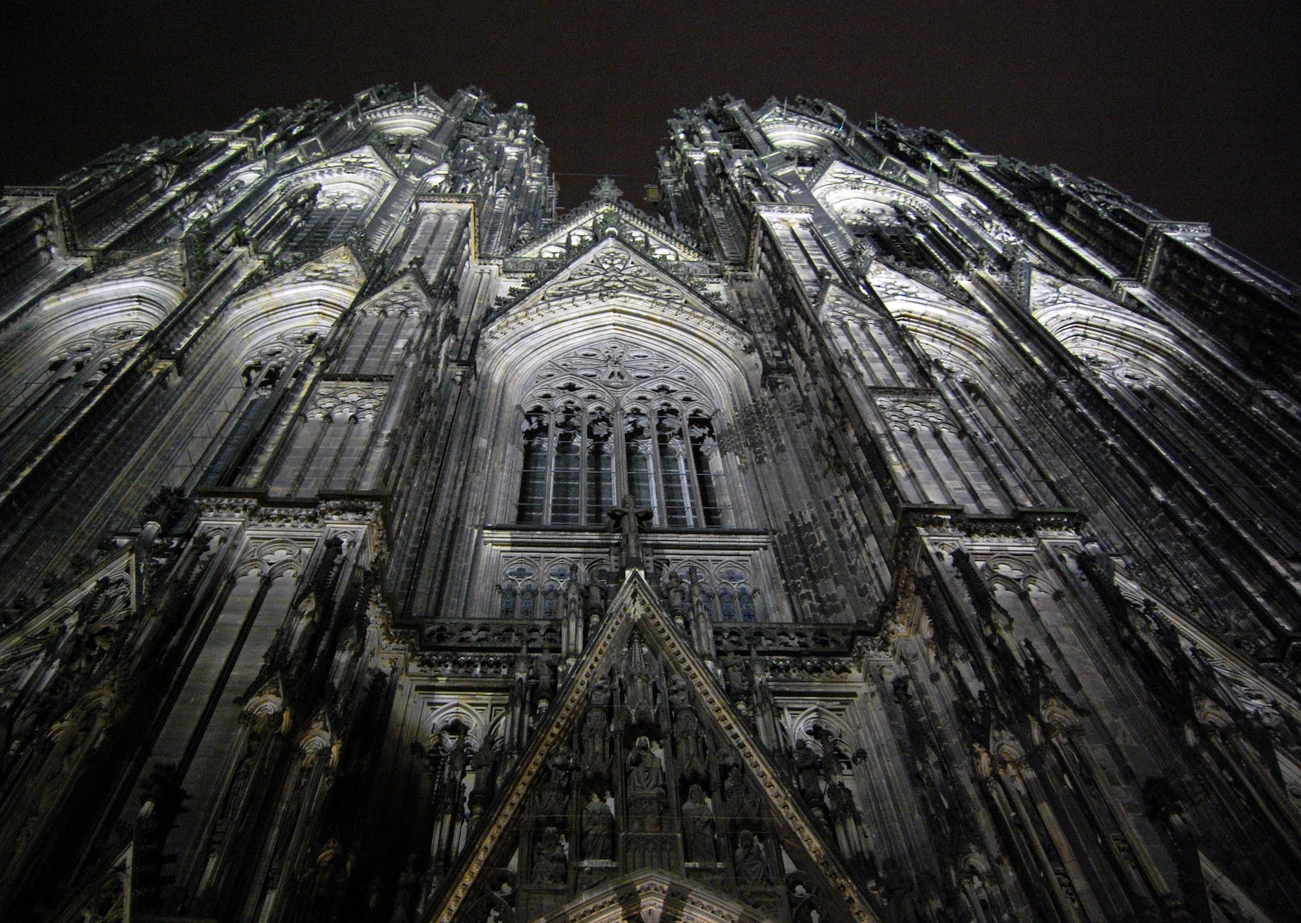 low angle photography of gray concrete cathedral at nighttime